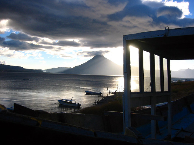 Boat water cloudy sky mountains free wallpaper for desktop - medium preview image
