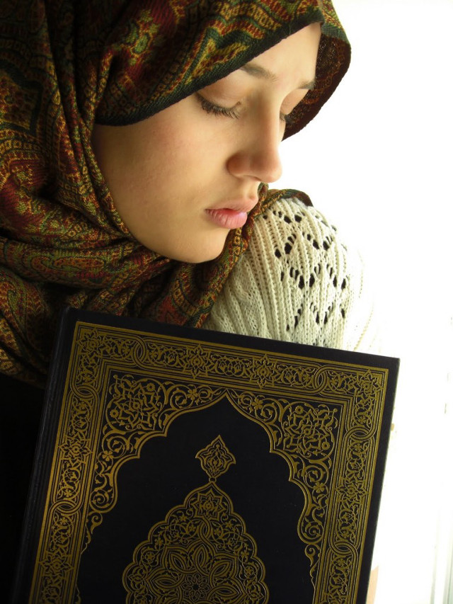 Woman headscarf holding book looking free wallpaper for mobile - medium preview image