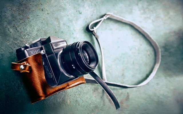 Camera leather case green surface free wallpaper for desktop - medium preview image