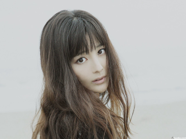 Woman long hair bangs serious free wallpaper for desktop - medium preview image