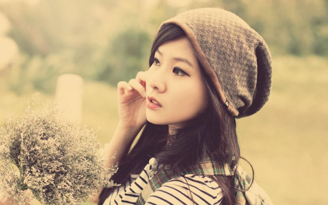 Woman hat holding bush looking free wallpaper for desktop - medium preview image