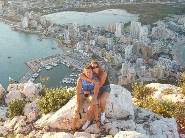 Women mountain overlooking city bay free wallpaper for desktop - medium preview image