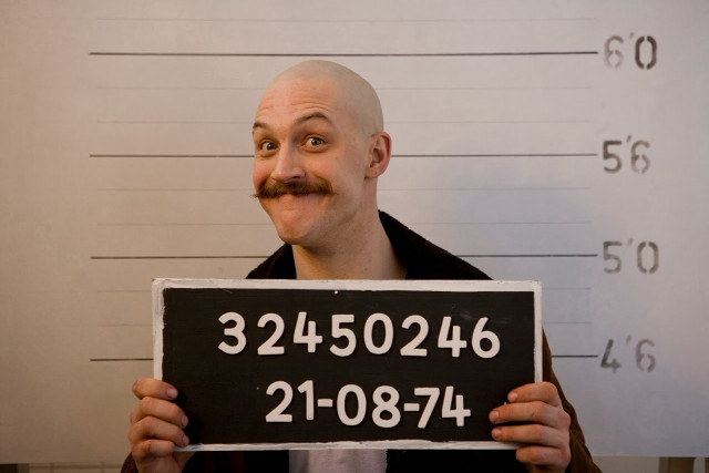 Man holding sign mustache mugshot free wallpaper for desktop - medium preview image