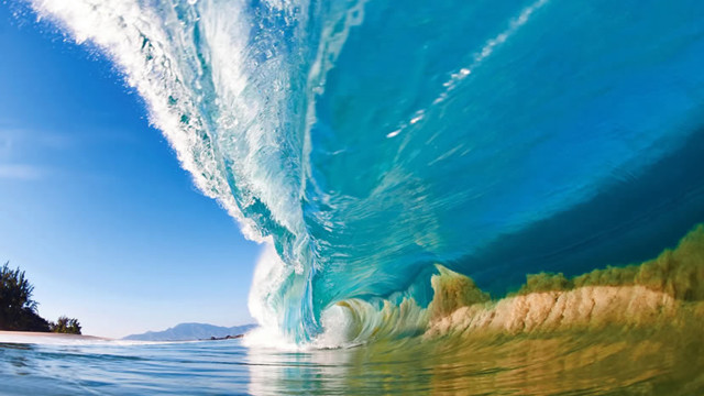 Large wave breaking beach island free wallpaper for desktop - medium preview image
