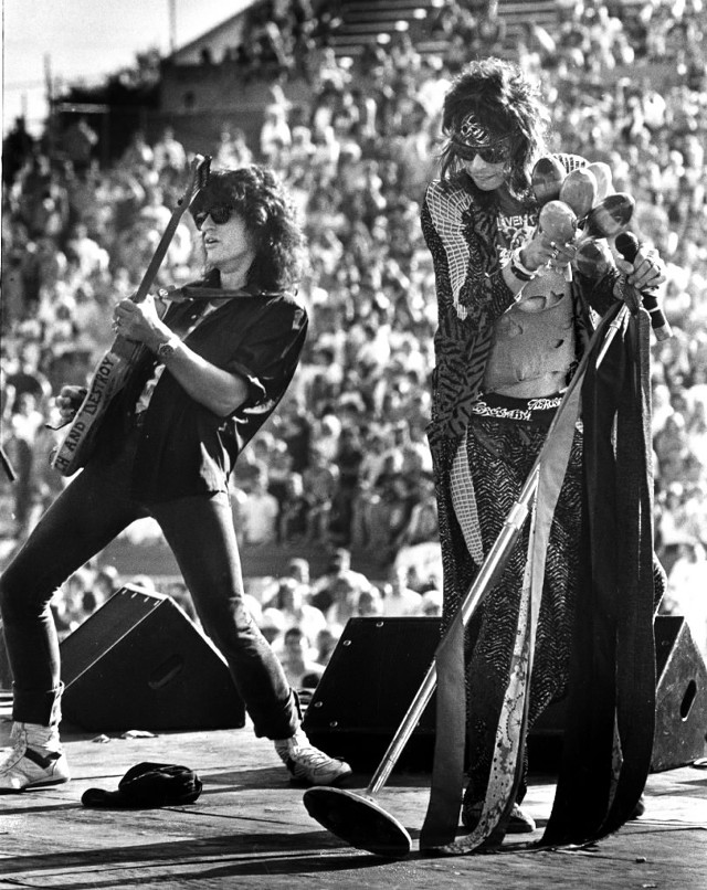 Couple guitars crowd standing performance free wallpaper for mobile - medium preview image