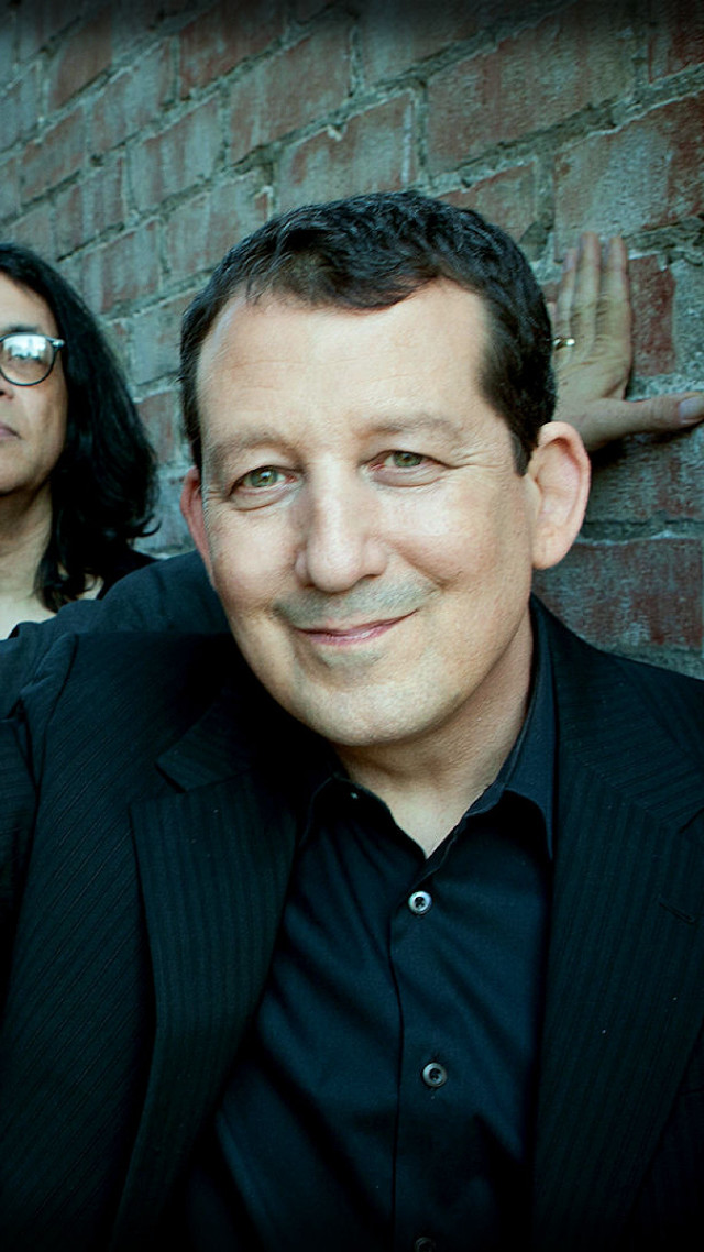 Man woman brick wall standing free wallpaper for mobile - medium preview image