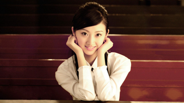 Woman smiling at table hands free wallpaper for desktop - medium preview image