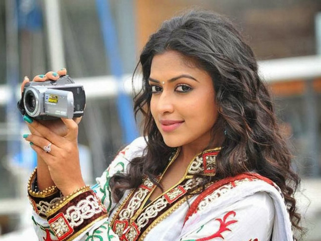 Woman colorful dress holding camera free wallpaper for desktop - medium preview image