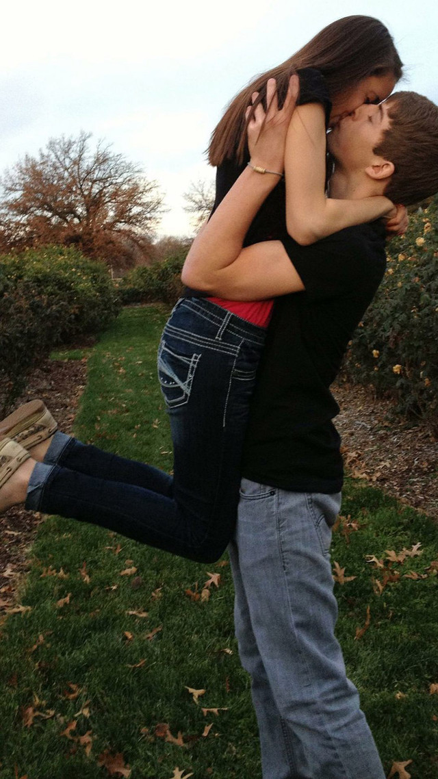 Man woman hugging field grass free wallpaper for mobile - medium preview image