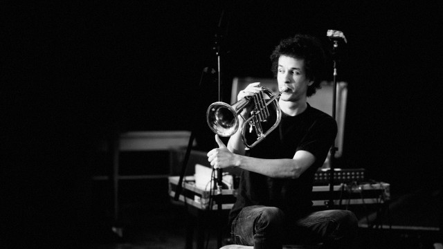 Man sitting chair holding trumpet free wallpaper for desktop - medium preview image