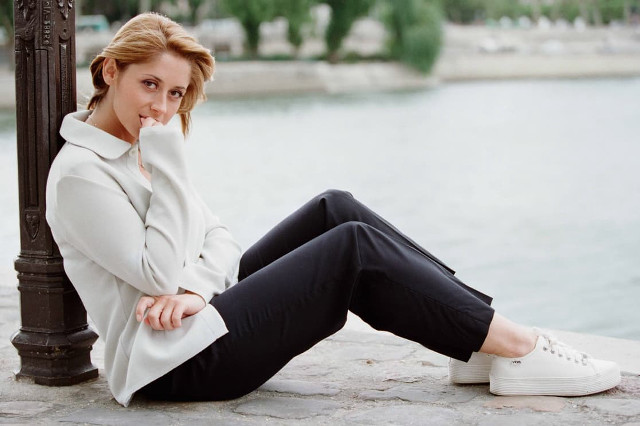 Elegant blonde woman stone wall free wallpaper for desktop - medium preview image