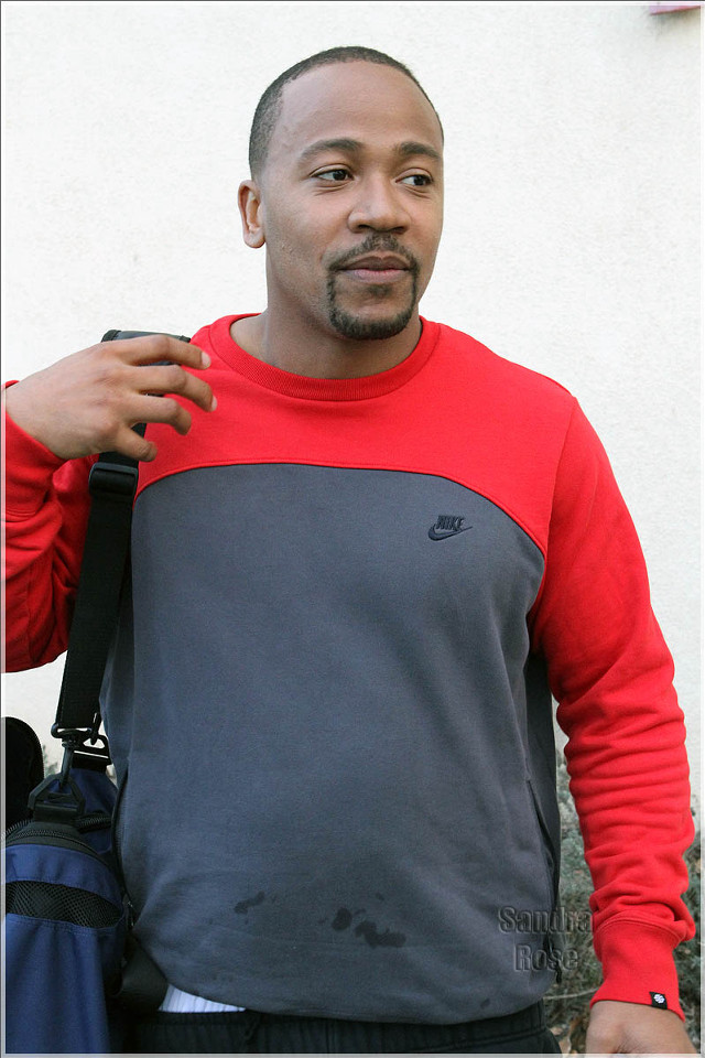 Man red grey shirt black free wallpaper for mobile - medium preview image