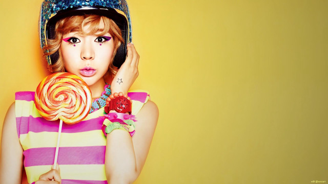 Woman helmet lollipop hand wearing free wallpaper for desktop - medium preview image