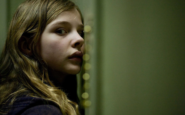 Young girl serious look camera free wallpaper for desktop - medium preview image