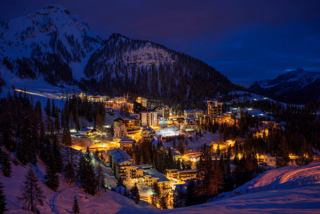 Snowy mountain town lit night free wallpaper for desktop - medium preview image