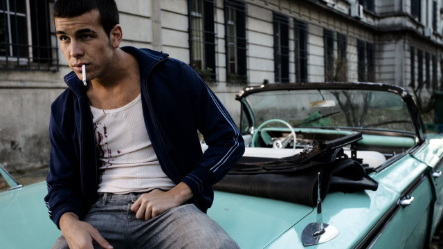 Man sitting blue car smoking free wallpaper for desktop - medium preview image