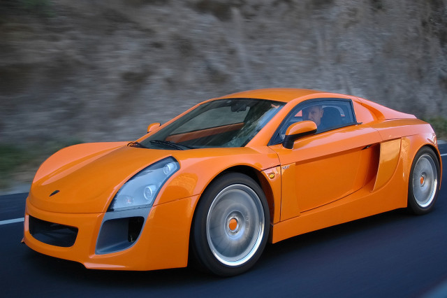Bright orange sports car cliff #2 free wallpaper for desktop - medium preview image