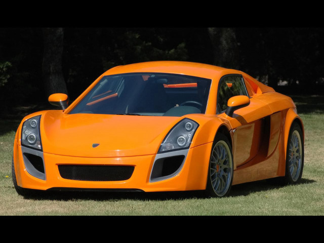 Bright orange sports car parked free wallpaper for desktop - medium preview image