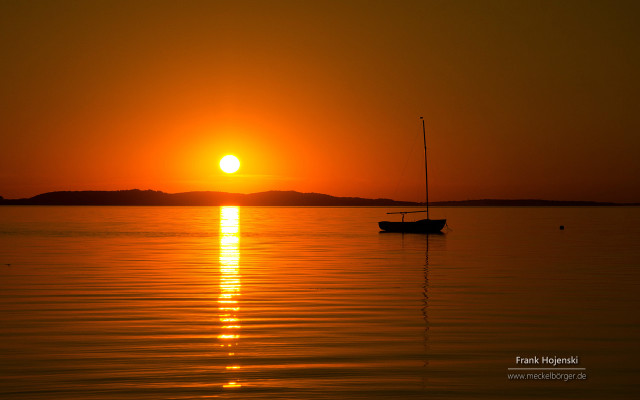 Boat sunset water peaceful scenery free wallpaper for desktop - medium preview image