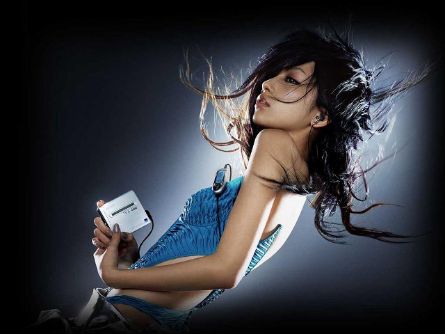 Woman blue dress holding phones free wallpaper for desktop - medium preview image