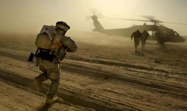 Soldiers walking dirt field helicopter free wallpaper for desktop - medium preview image
