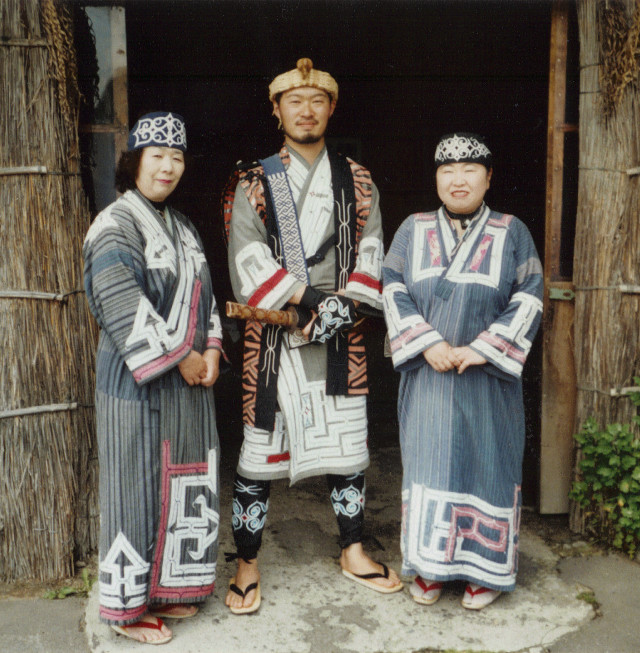 Three people native clothing hut free wallpaper for tablet - medium preview image