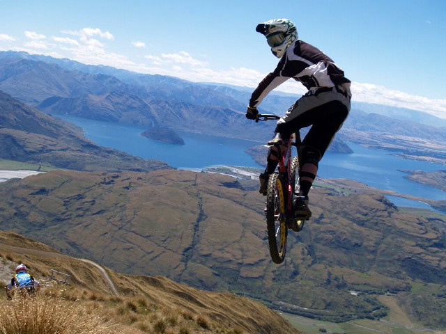 Man riding bike mountain lake #3 free wallpaper for desktop - medium preview image