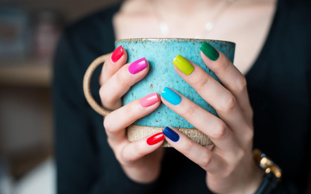 Woman holding cup colorful nails free wallpaper for desktop - medium preview image