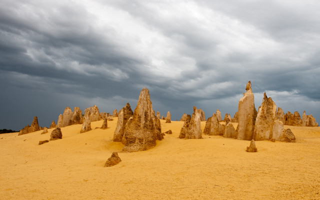 Rocks desert cloudy sky person free wallpaper for desktop - medium preview image