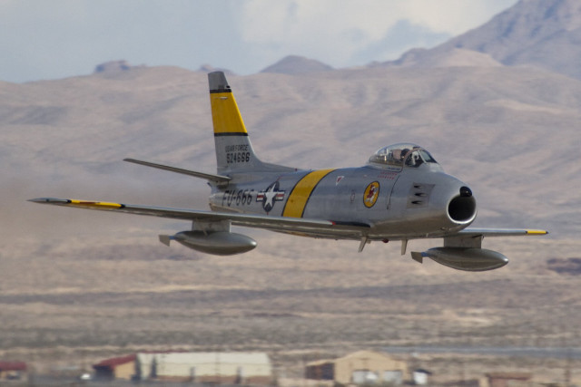Fighter jet flying mountains skyline free wallpaper for desktop - medium preview image
