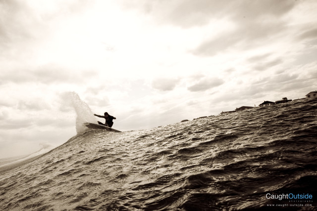 Surfboard riding wave ocean cloudy free wallpaper for desktop - medium preview image