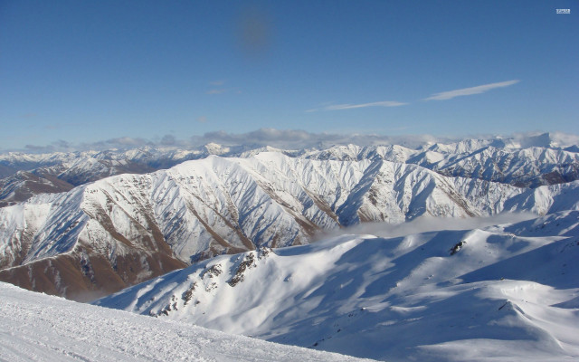 Snowboarder snowy mountain top background #2 free wallpaper for desktop - medium preview image