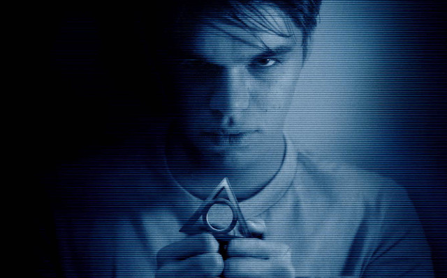 Man holding scissors dark room free wallpaper for desktop - medium preview image