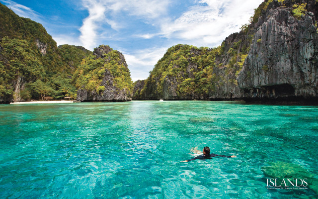 Swimming lagoon cliffs blue sky free wallpaper for desktop - medium preview image