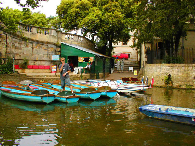 Man standing boats water building free wallpaper for desktop - medium preview image