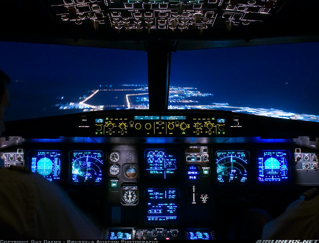 Man cockpit plane night lights free wallpaper for desktop - medium preview image