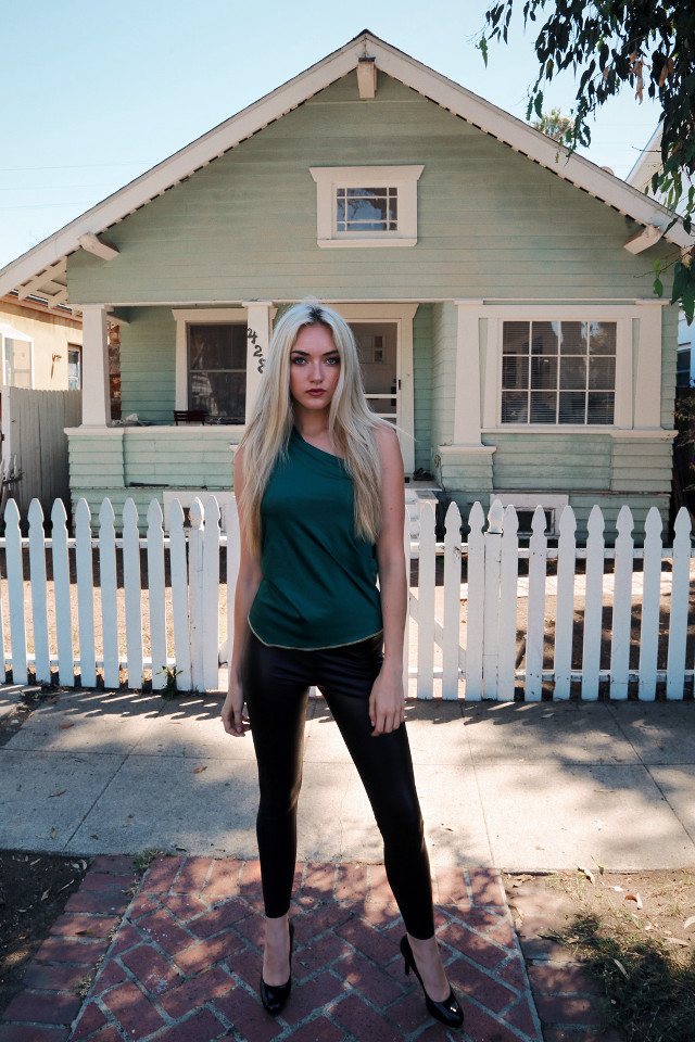 Woman standing house white picket free wallpaper for mobile - medium preview image