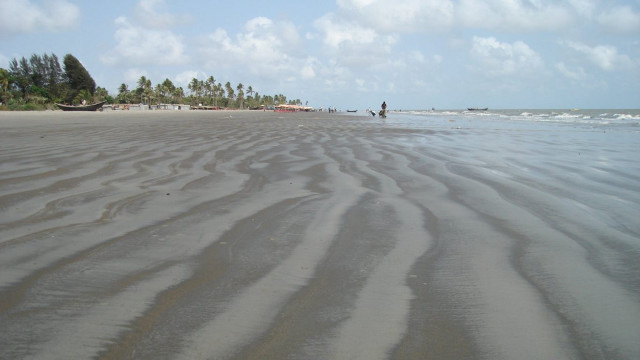 Sandy beach people walking water free wallpaper for desktop - medium preview image