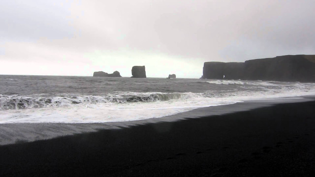 Black beach waves crashing rock free wallpaper for desktop - medium preview image