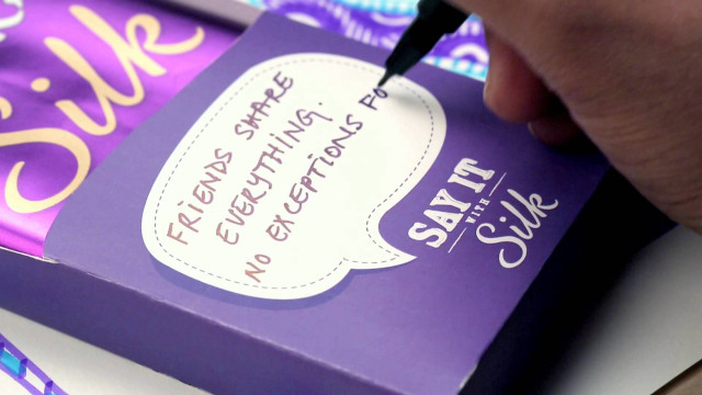 Person writing purple box note free wallpaper for desktop - medium preview image