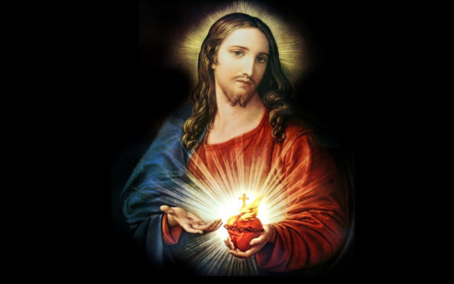 Jesus holding heart glowing light free wallpaper for desktop - medium preview image