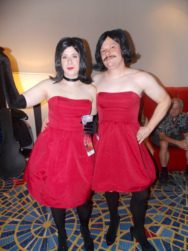 Two women red dresses blue free wallpaper for mobile - medium preview image