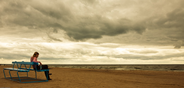 Woman bench beach cloudy sky free wallpaper for desktop - medium preview image