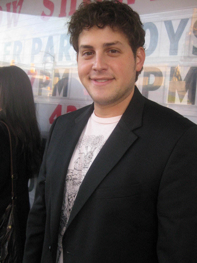 Man suit sign woman behind free wallpaper for mobile - medium preview image