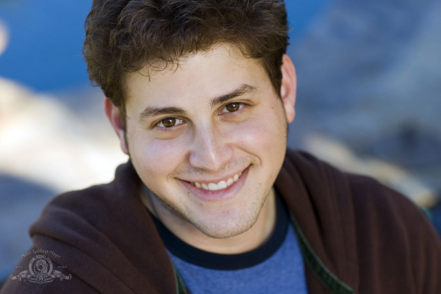 Man brown jacket smiling mountain free wallpaper for desktop - medium preview image