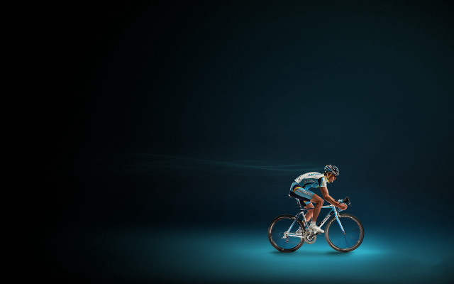 Man riding bike dark background free wallpaper for desktop - medium preview image
