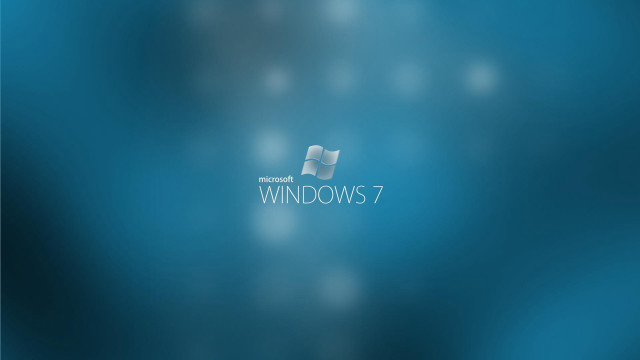 Blue windows7 logo blurry background free wallpaper for desktop - medium preview image