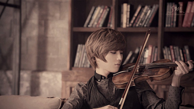 Young man violin library bookshelves free wallpaper for desktop - medium preview image