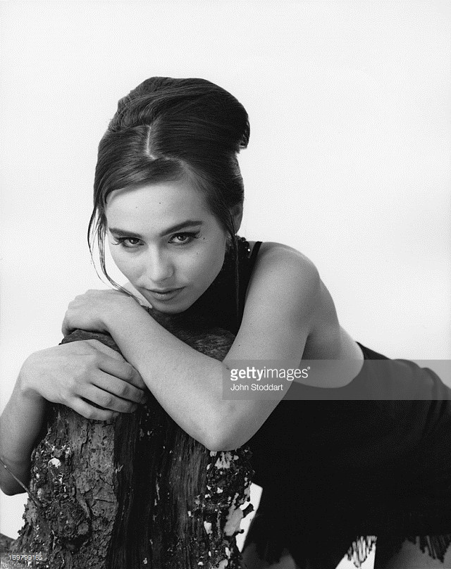 Woman leaning tree arms crossed free wallpaper for mobile - medium preview image