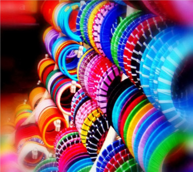 Colorful frisbees stacked table row free wallpaper for tablet - medium preview image